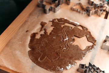 Gingerbread Dough With Cookie Cutters On Baking Paper