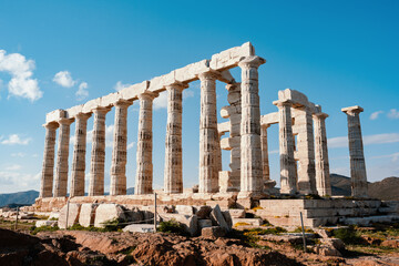 Fototapeta premium Temple Of Poseidon At Cape Sounion Under Blue Sky
