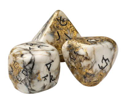 Three dice, off-white with gold flecks and dark markings, various shapes and numbers