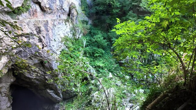 Exterior of the impressive Skocjan Cave, entrance to the grotto in the mountain, Slovenia.