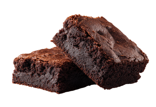 Two rich, dark brownies, sliced and overlapping