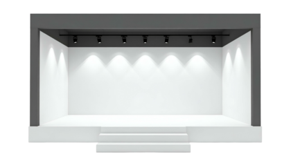 A minimalist stage lit by spotlights, with a white backdrop and a dark gray frame