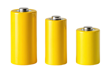 Three yellow cylindrical batteries of varying sizes,  isolated on black