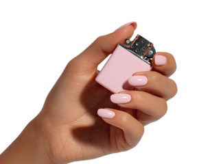A hand holds a small, light pink lighter.  Nude nails
