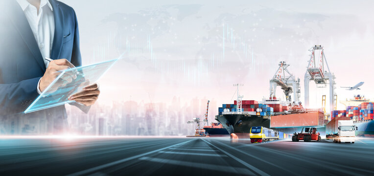 Global Digital Logistics and Supply Chain Management. Businessman Planning Future Freight Transportation Network with Smart Tablet for Worldwide Cargo Shipping, Modern Trade, and Multimodal Solutions.