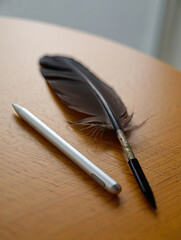 A fine art portrait capturing the golden melancholy of autumn, featuring a woman with auburn hair and a man with dark chestnut curls standing in a softly lit studio filled with falling amber leaves. T