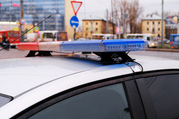 A Police Vehicle has Emergency Lights on its Rooftop, signaling urgency to the public