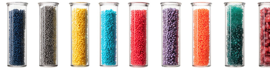 Assorted small, colored, granular materials in clear cylindrical containers