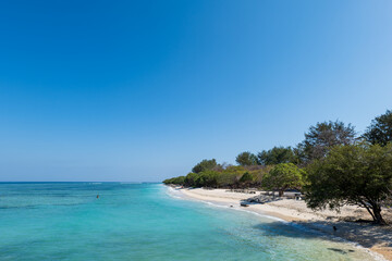 Fototapeta premium Tropical white sand beach, for holiday and vacation by sea in paradise, Gili Islands, Lombok, Indonesia