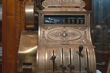Old ornate brass cash register showing amount due