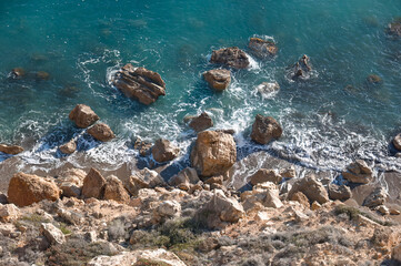 Turquoise Mediterranean sea crashing on rocky shore, Cyprus