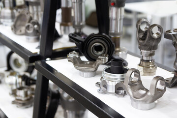 Transmission elements and other car parts on display in a store