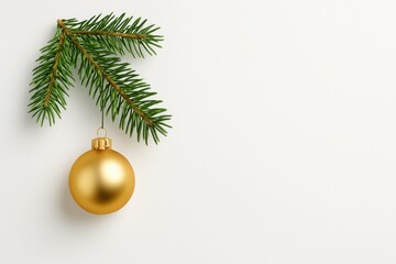 Gold Christmas ornament hanging from fir branch on white background with space for text, clean festive composition for seasonal design and marketing visuals