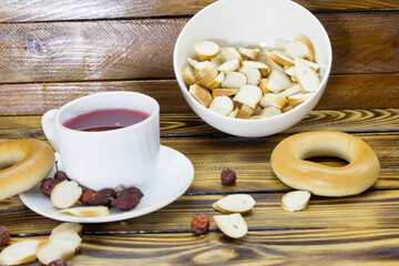 A cup of rosehip tea and bagels.