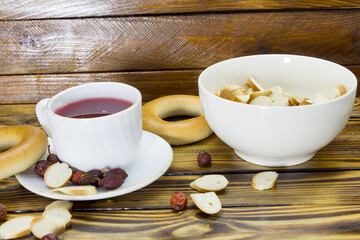 A cup of rosehip tea and bagels.