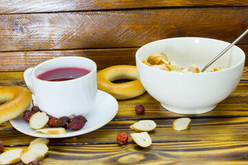 A cup of rosehip tea and bagels.