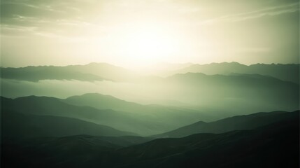 Obraz premium Distant mountains shrouded in fog during rainy daylight hours
