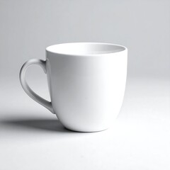 Obraz premium A plain, ceramic mug with a handle, set against a soft gray background