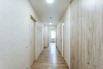 elegant modern corridor, minimalist hallway with sunlight, contemporary design accentuating sleek hallway features, stylish corridor emphasizing natural light and minimalist