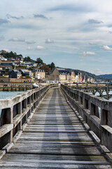 Single perspective view of a wooden quay in Fecamp, France