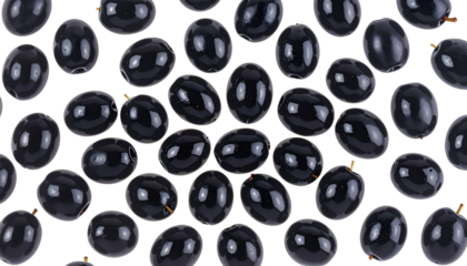 Top-down shot of numerous, shiny, black olives against a stark black background