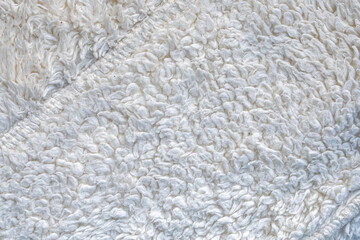 white plush fabric texture background , background pattern of soft warm material	