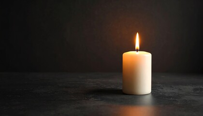 Single glowing candle flame on dark background creating a calming and serene atmosphere of light