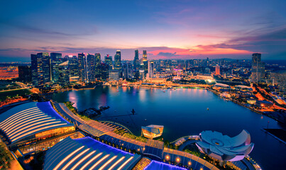 Singapore Skyline and view of skyscrapers on Marina Bay at sunset.