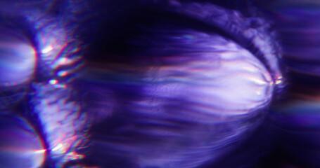 Defocused light. Gleam glow. Purple blue color optical rainbow twirl illuminated texture on...