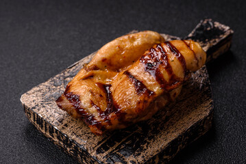 Grilled boneless chicken legs baked on the barbecue for lunch. Grilled chicken as a background