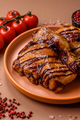 Grilled boneless chicken legs baked on the barbecue for lunch. Grilled chicken as a background