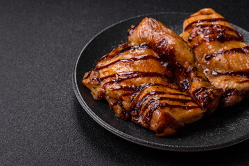 Grilled boneless chicken legs baked on the barbecue for lunch. Grilled chicken as a background