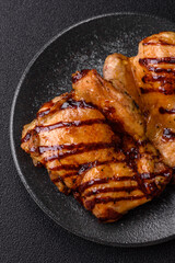 Grilled boneless chicken legs baked on the barbecue for lunch. Grilled chicken as a background