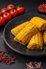Corn cob cooked in chunks, vegetables, healthy vegetarian food. Boiled corn as a background