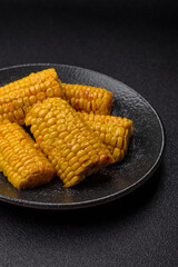 Corn cob cooked in chunks, vegetables, healthy vegetarian food. Boiled corn as a background