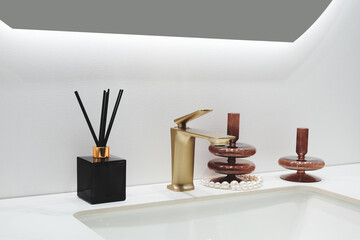 Interior of a bright bathroom with a white ceramic sink, modern faucet, and mirror