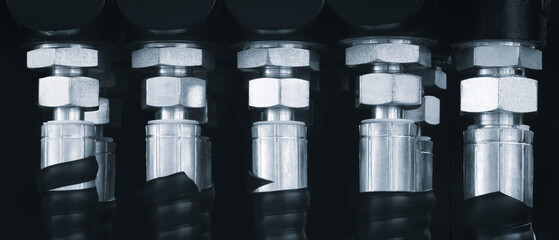 High pressure tubes connected to hydraulic or pneumatic pressure system in large industrial machine, industrial pressure concept background