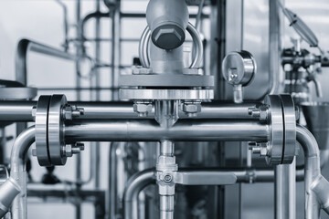 view of industrial machine pipes in factory, industrial concept background.