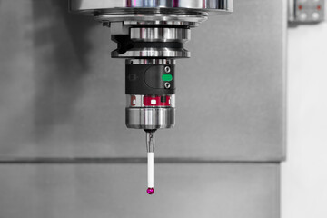 Tactile sensor of Coordinate Measuring Machine CMM, for testing the dimensions of parts, technology concept background.