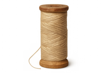 Spool of natural beige thread on a wooden bobbin for knitting and craft projects, transparent background
