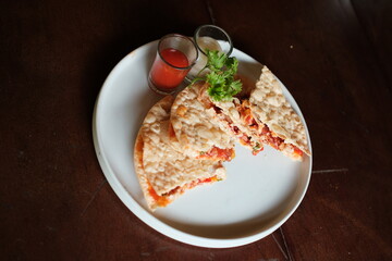 Delicious quesadillas served on a white plate with dipping sauces, perfect for food blogs and restaurant menus, enticing appetites with vibrant flavors