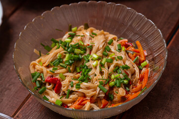 Udon noodles with saut ed vegetables in teriyaki sauce