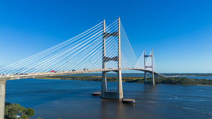 Aerial view of modern suspension bridge over the water 