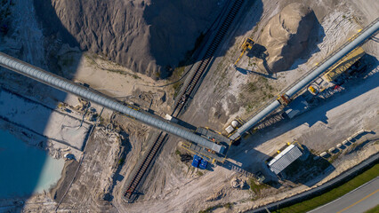 aerial view of sand dunes and conveyer belts at concrete factory