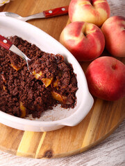 Homemade Chocolate peach crumble dessert in a tin