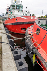 Close-up of Two Tugboats Docked Side by Side