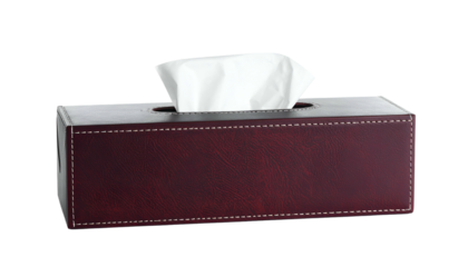 A rectangular tissue box, brown leather-look exterior, with white tissues protruding from the top