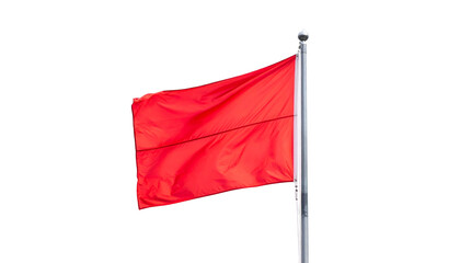 A bright red rectangular flag flutters in the wind against a stark black background