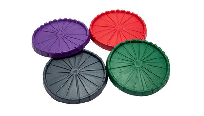 Four colorful, ribbed, circular plastic components with central holes, against black