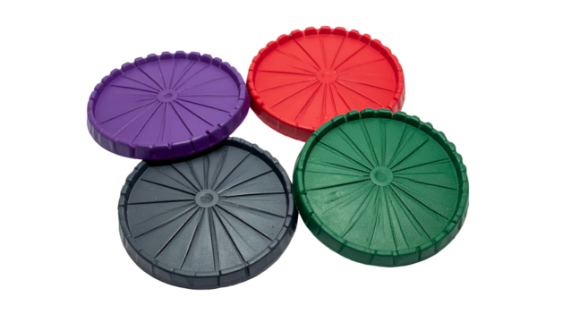 Four colorful, ribbed, circular plastic components with central holes, against black